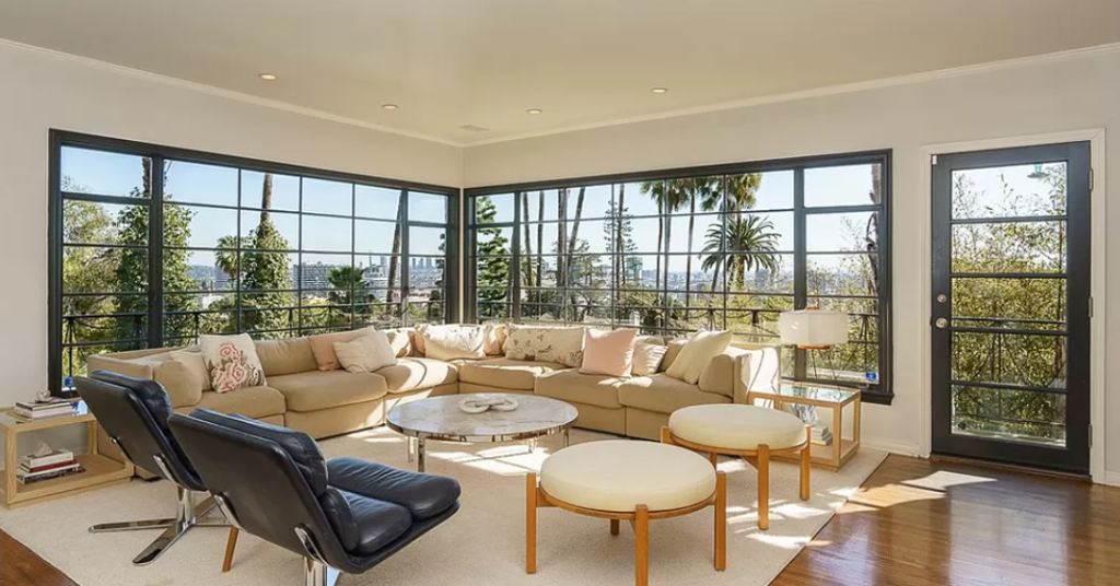 Open living spaces and walls of windows in the historic home.