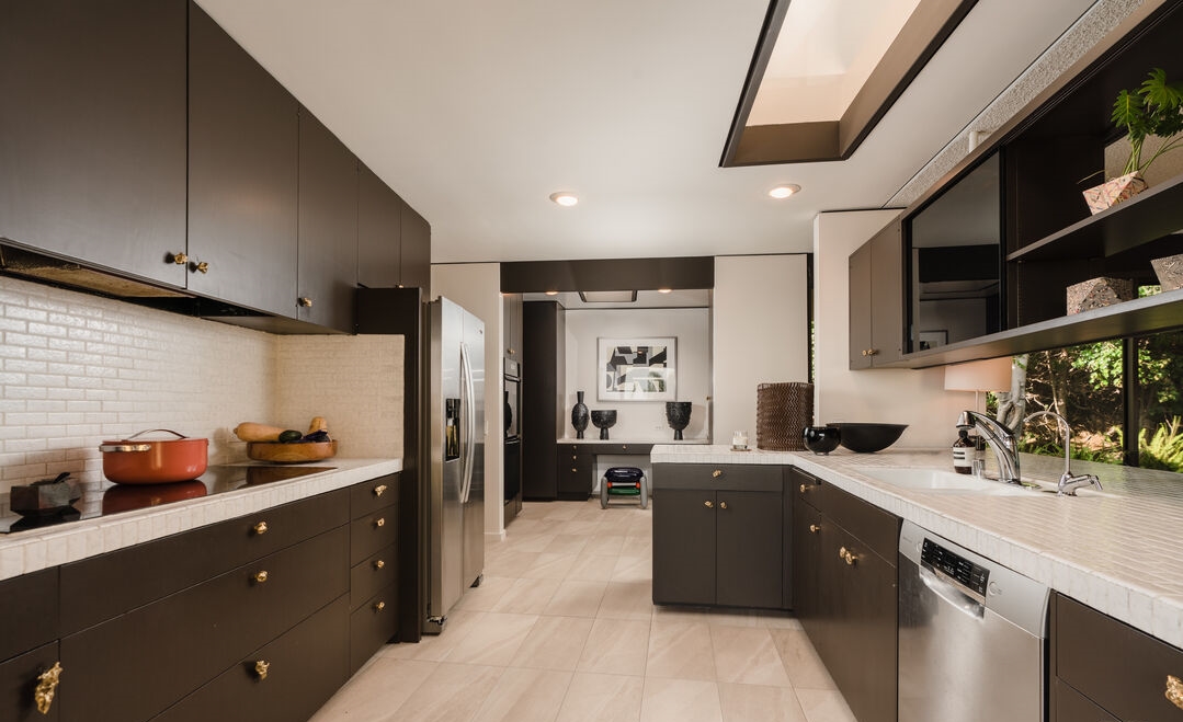 Incredible design in this contemporary kitchen designed with passthrough to dining area.