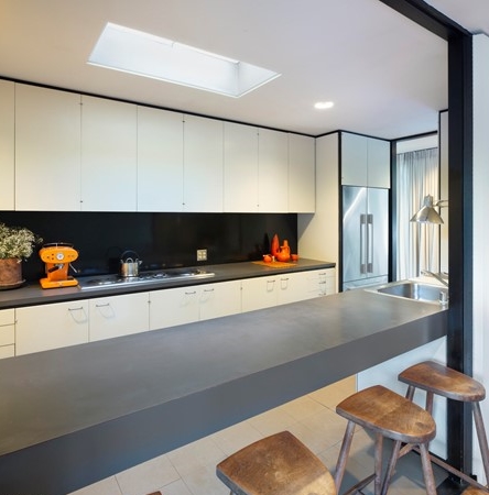 Contemporary kitchen with clean lines, classic white and dramatic black accent details.