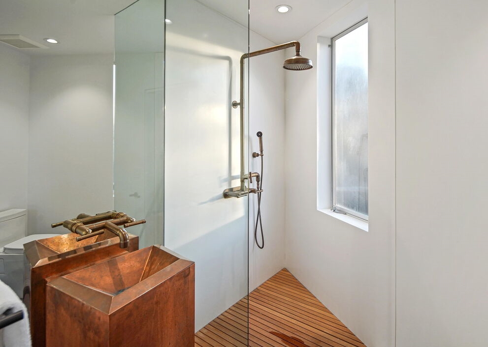 Hollywood Hills Lautner-Designed Glass enclosed shower and ornate sink, in classic mid century home.