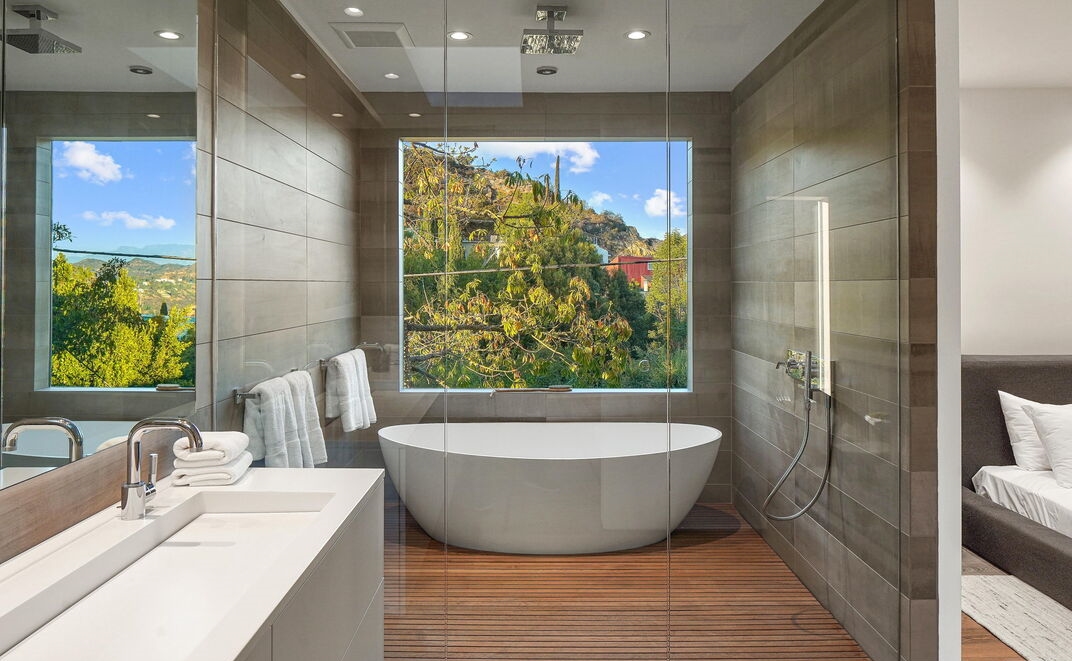 Hollywood Hills Lautner-Designed Incredible over-sized glass enclosed tub with breathtaking views.