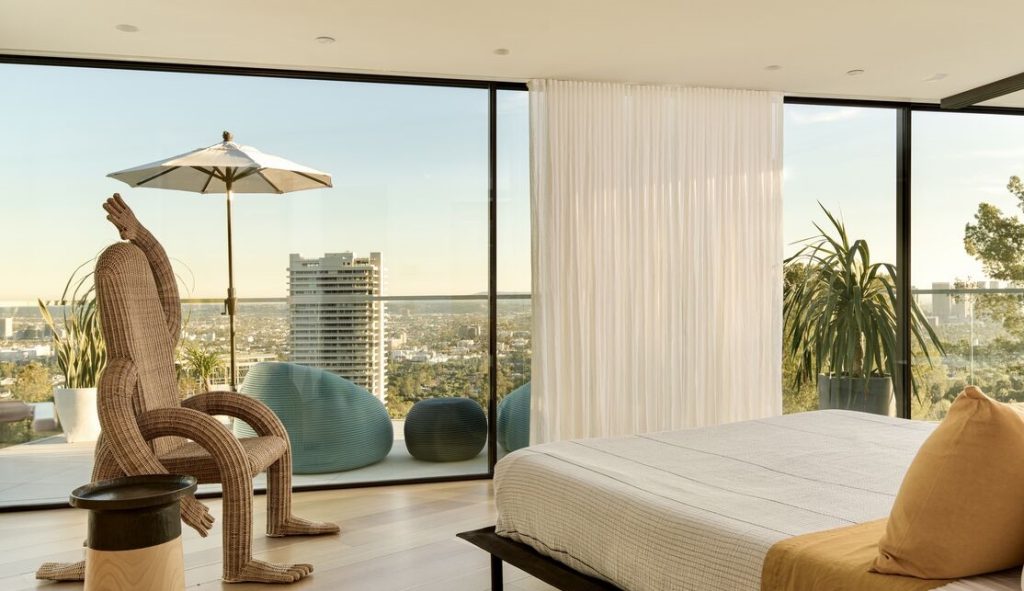 Hollywood Hills mid century home with this glass enclosed primary bedroom.