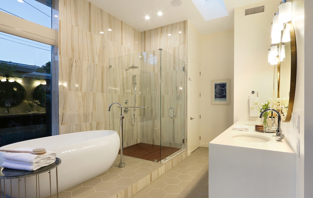 Classic white throughout the luxurious bathroom, with grand freestanding tub.