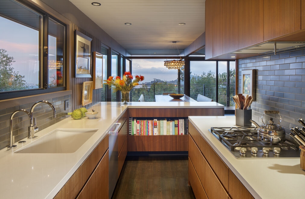 Great architectural design in this open kitchen with even more windows out to jetliner views.