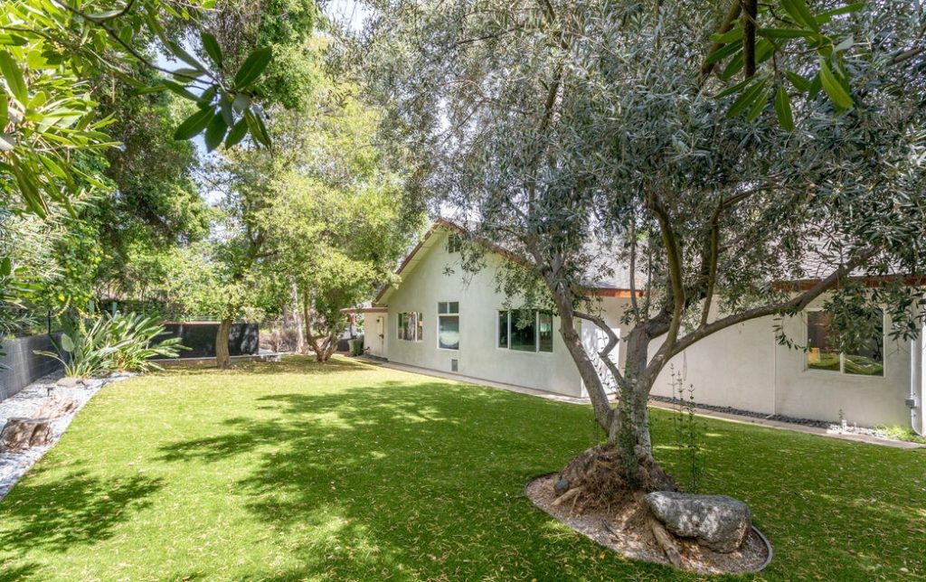Encino Hills private gated mid century modern. Amazing yard encompasses huge lush grass area.