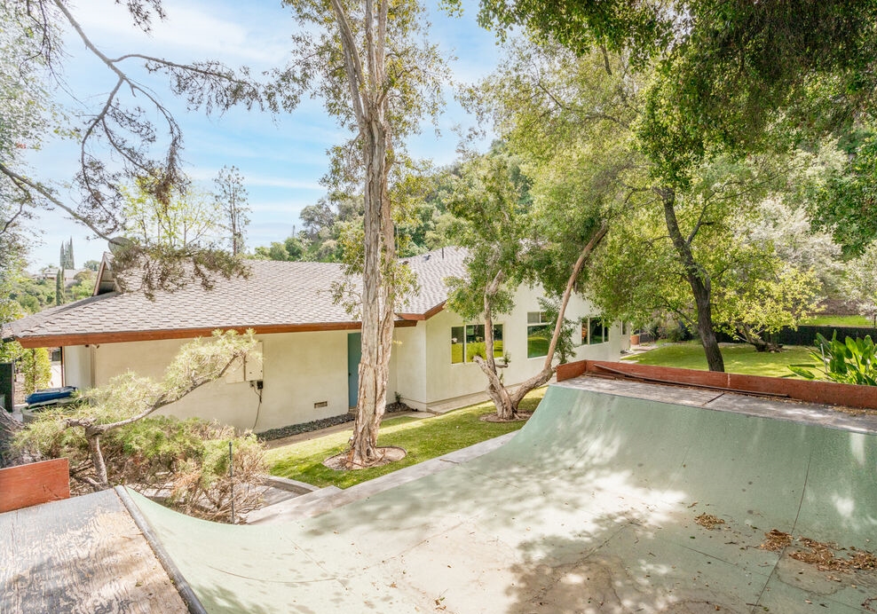 Encino Hills private gated mid century modern home. Amazing skate board ramp with ample room to practice included in the rear yard.