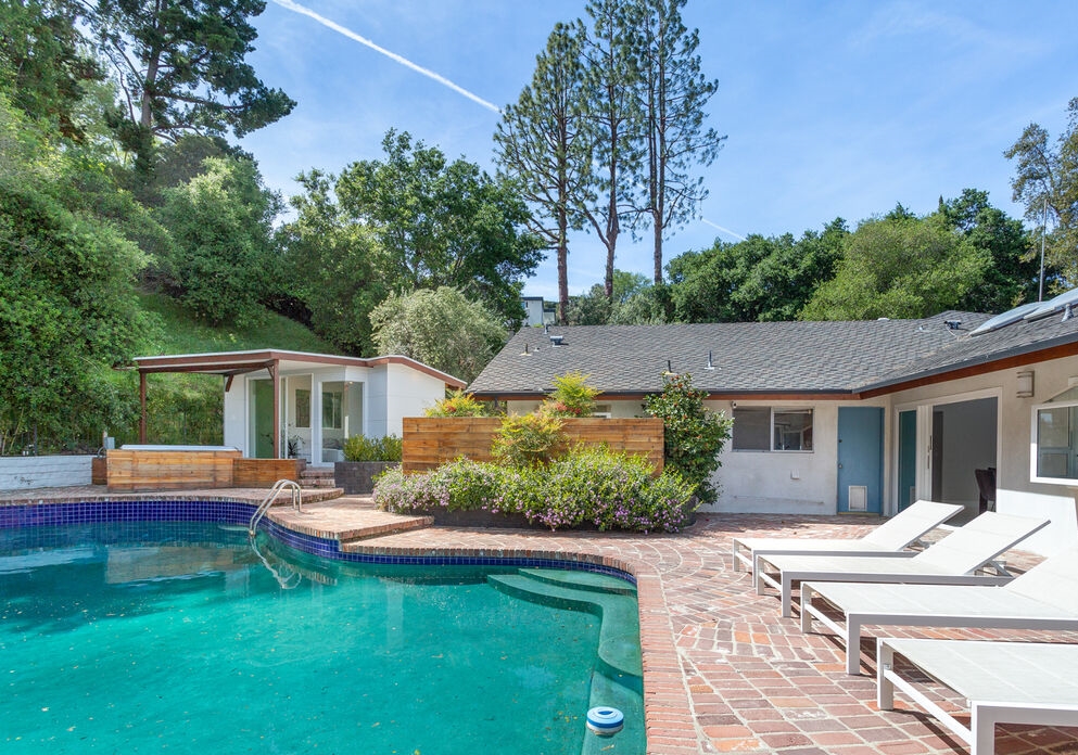 Poolside view of magnificent Encino mid century home.