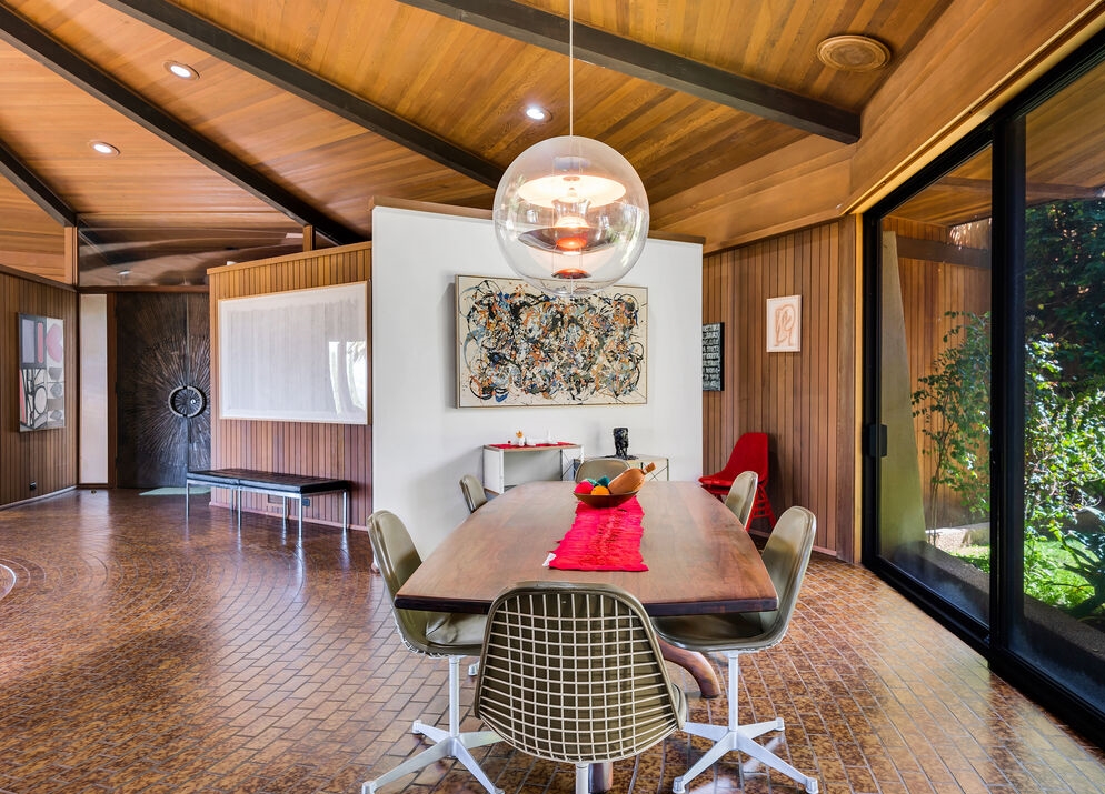 Encino The Lewis-Loughrey Estate. Ceilings with magnificent wood crafting features more walls of glass opening to views of the lush yard and beyond.