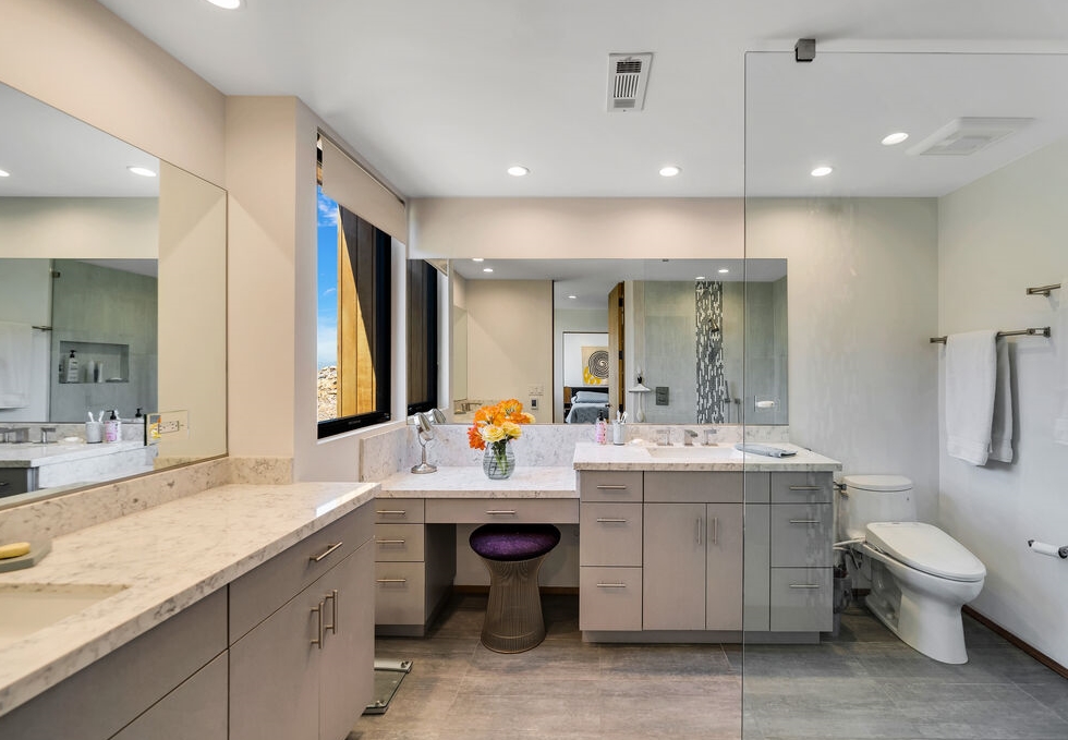 Encino The Lewis-Loughrey Estate. Secondary bathroom suite with grand dual vanities attaches to living area