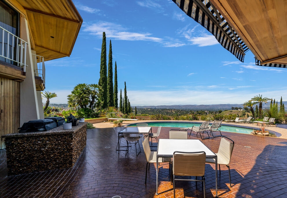 Sparkling pool overlooks the canyon and city views.