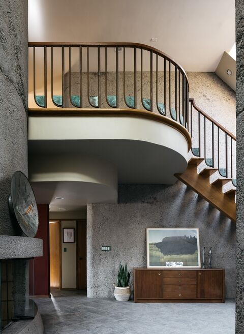 La Crescenta Eric Lloyd Wright A breathtaking sweeping entry comprised of curved aggregate concrete with dramatic windows and staircase.