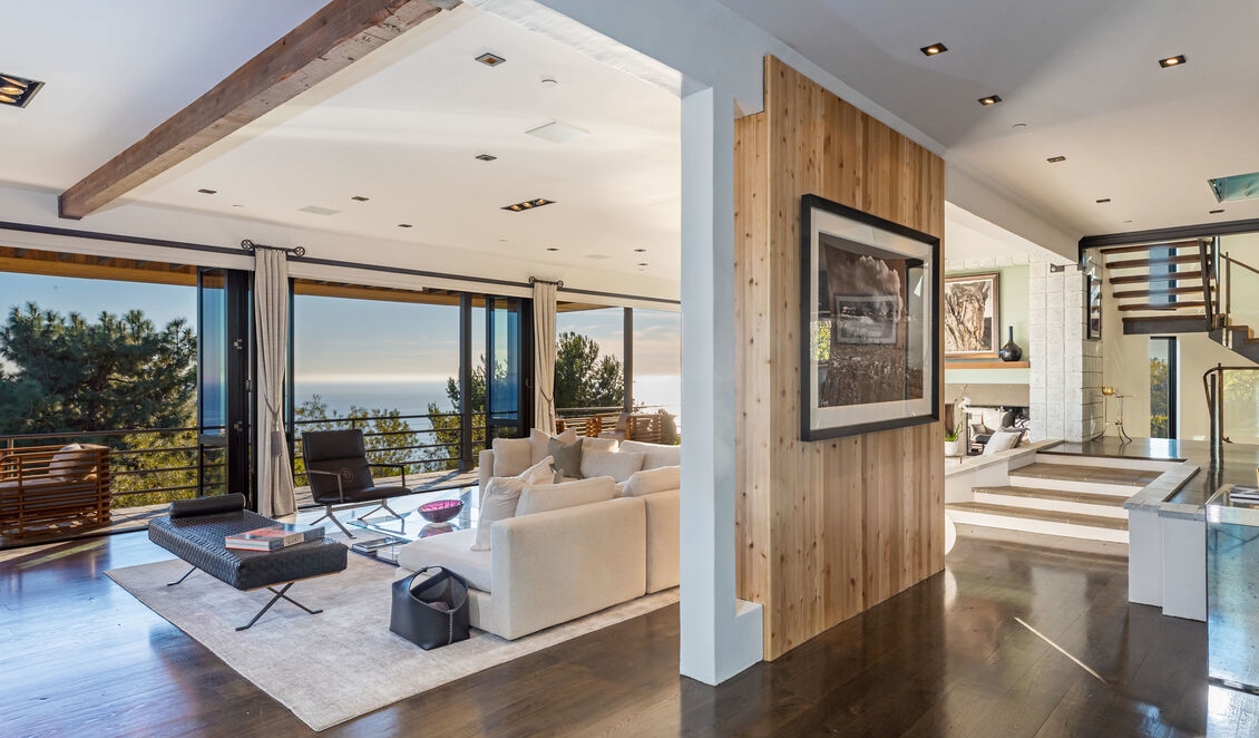 High ceilings, art walls, a large dining room and cook's kitchen with more ocean views.