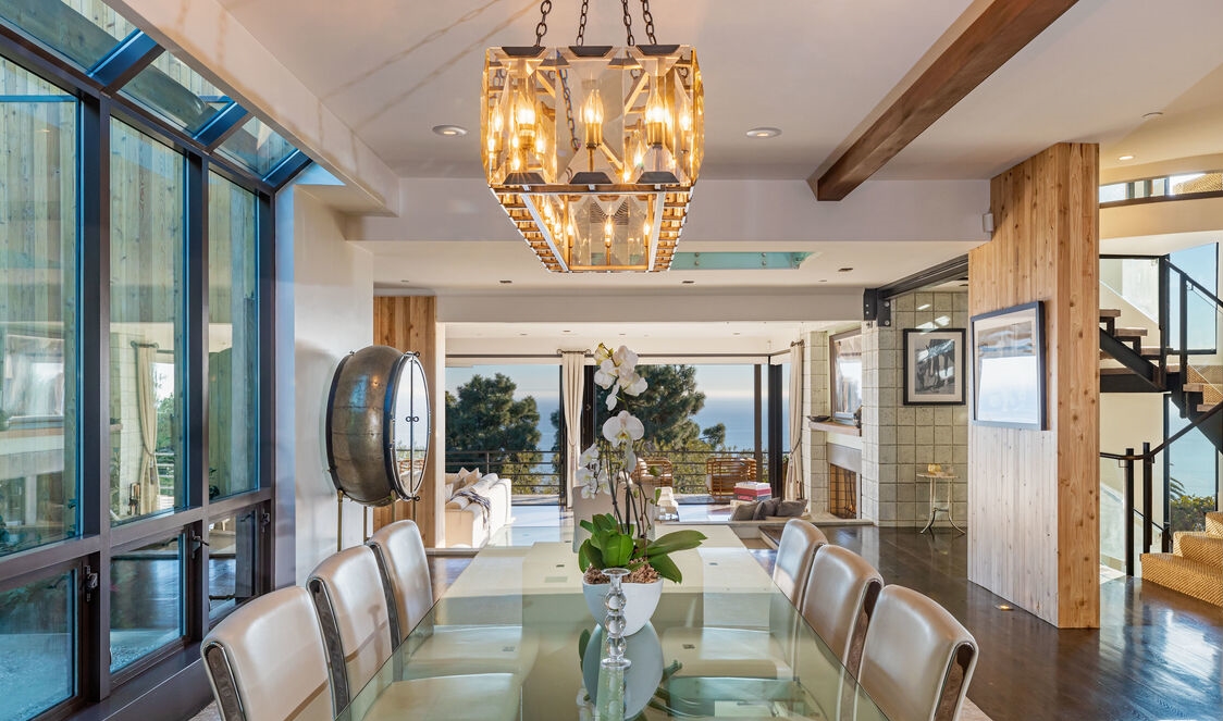 Magnificent formal dining room enclosed in glass and unmatched ocean views.