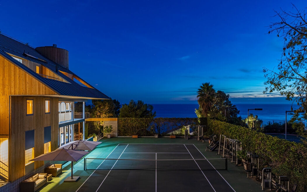 Spectacular Malibu architectural estate, with impressive walls of glass, and awe-inspiring ocean and sunset views.