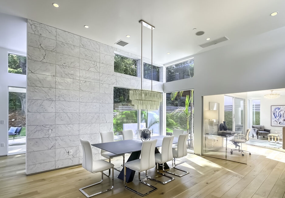Prime location Encino Rancho Estates! Fabulous dining area features freestanding white walls and windows everywhere bringing in an abundance of natural light.