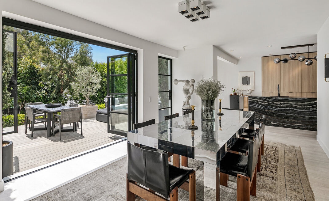 Magnificent dining room completely opens to rear yard entertaining