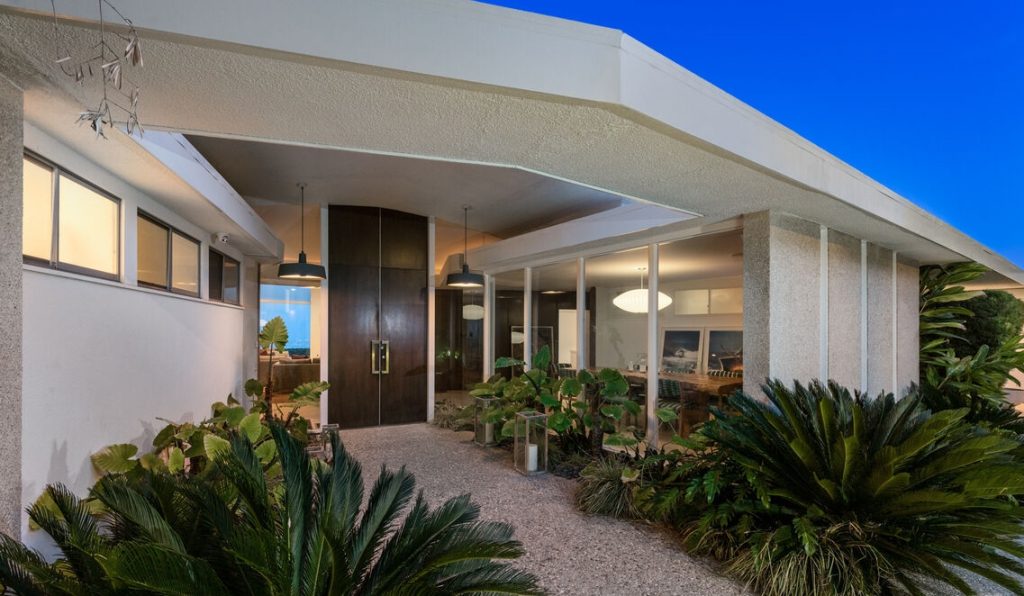 Beverly Hills Architectural Masterpiece grand entrance with walls of windows.