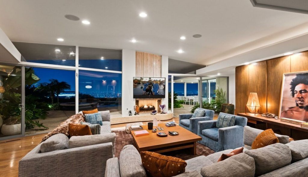 Grand living area with custom crafted woodworking and walls of glass out to unbelievable views.