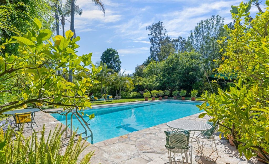 Bel Air Luxury Spanish the Ernst Lubitsch Estate features a Remarkable Grand Pool and lush rear yard.
