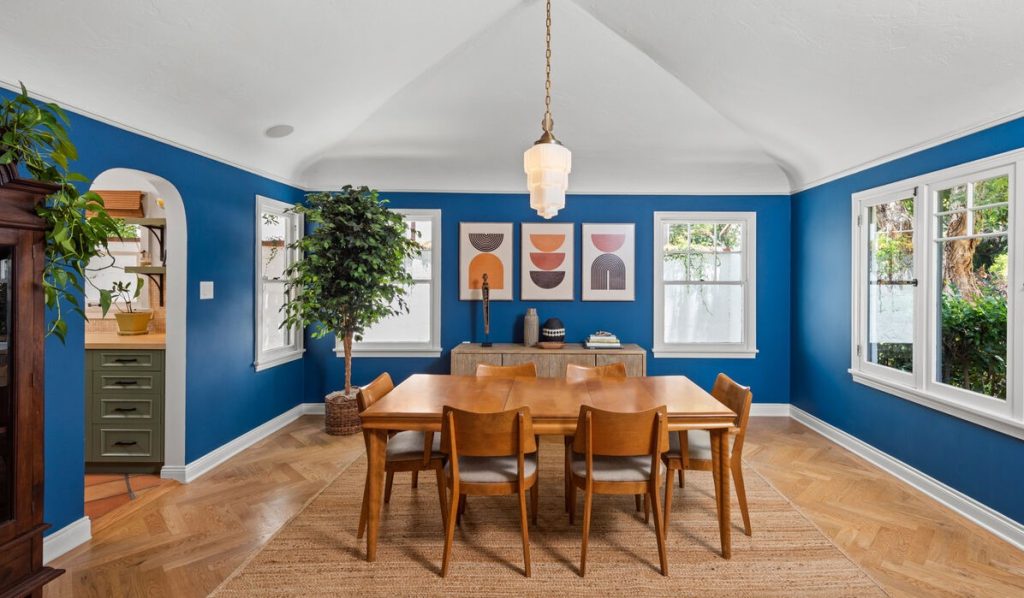 Hollywood Hills Unique Spanish Colonial formal dining room with dramatic ceilings, arched doorways and walls of windows