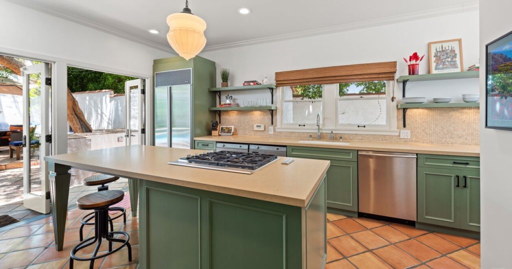 Fabulous chef's kitchen with center island and opens to fabuolus rear entertainment yard.