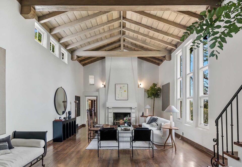 Classic Spanish Architectural Stunning Sunset Strip home amazing fireplace in this Magnificent high beamed ceilings in huge classic Living Room