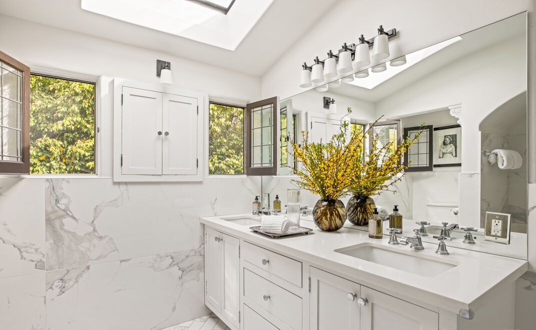 Rare timeless elegance in this chic bathroom with white marble accents.
