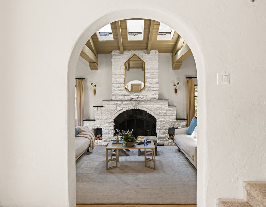 Remarkable wall fireplace in this classic beamed ceiling Spanish living room