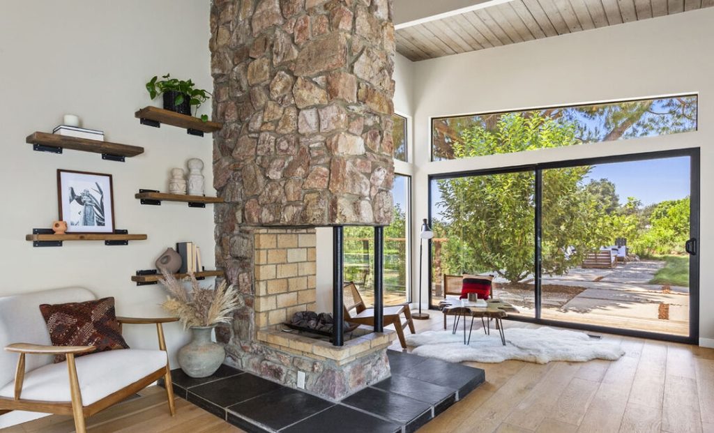 Fabulous family room with remarkable stone fireplace and wood ceilings 