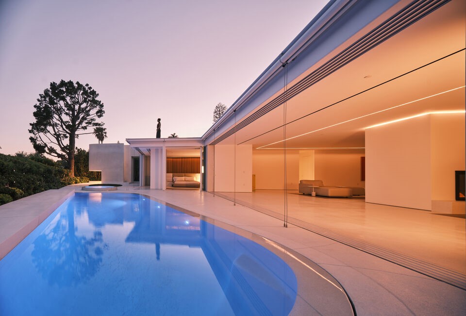 Trousdale, Walls of glass open to this spectacular pool yard in the architectural gem