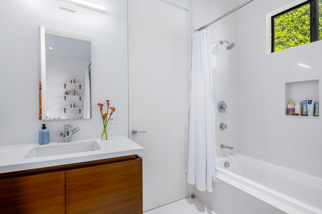 Classic white throughout with large glass enclosed shower