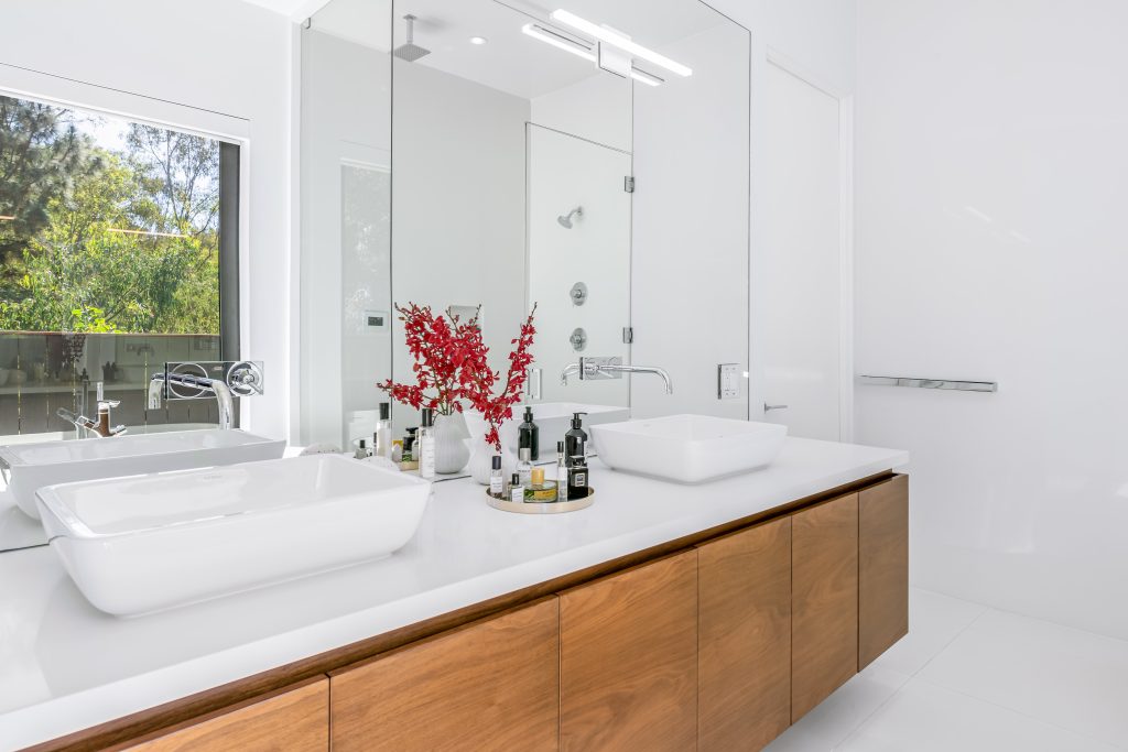 Unique quality primary bathroom with fabulous vanity, custom dual sinks and appointments.
