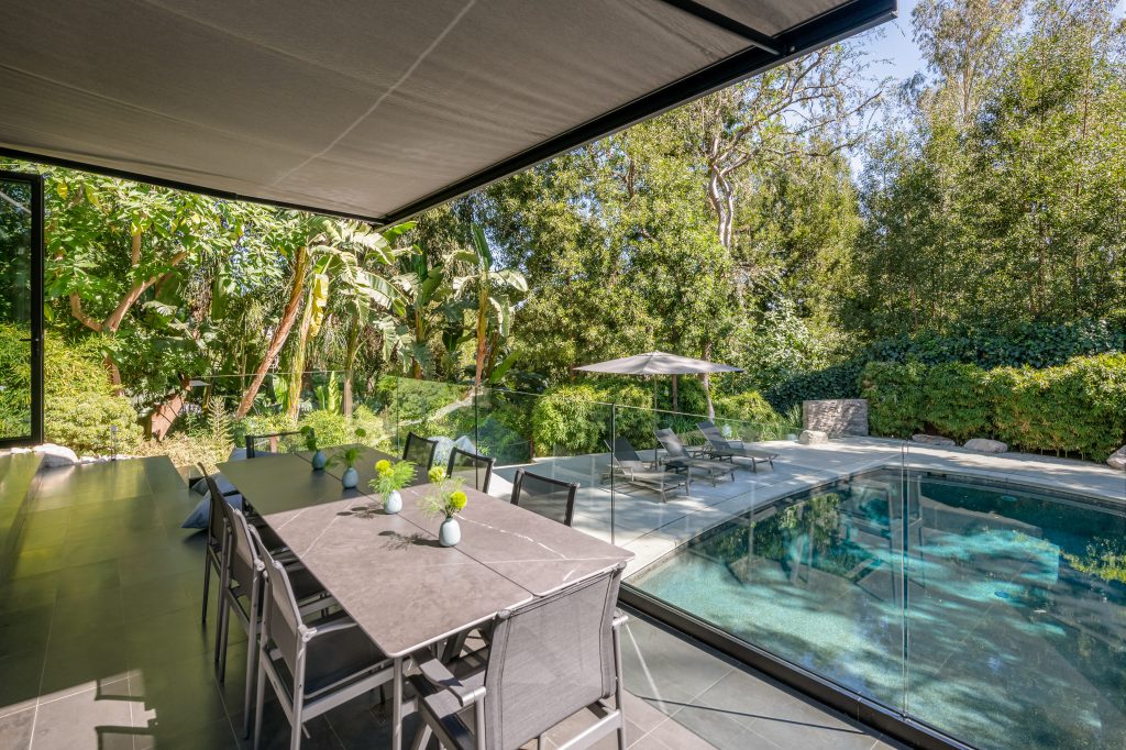 Hollywood Hills Exceptional oversized canopy can be extended over the outside dining area for eating al fresco year-round.