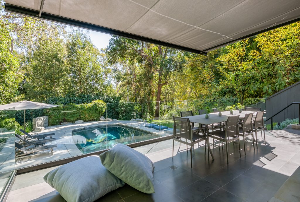 Hollywood Hills Exceptional oversized canopy can be extended over the outside dining area for eating al fresco year-round.