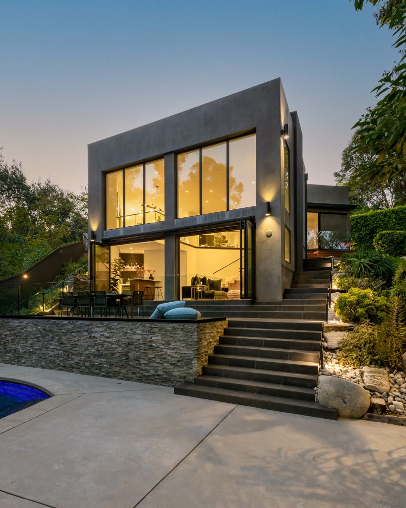 Hollywood Hills Exceptional designs in the modern architectural with grand windows overlooking romantic pool yard.