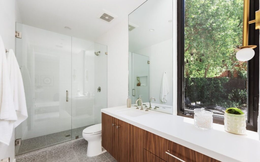 Magnificent primary bathroom with glass enclosed shower