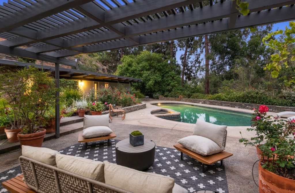 Beautiful outdoor entertaining area in this Amazing pool yard in this remarkable Pacific Palisades Extraordinary Mid Century Modern home.