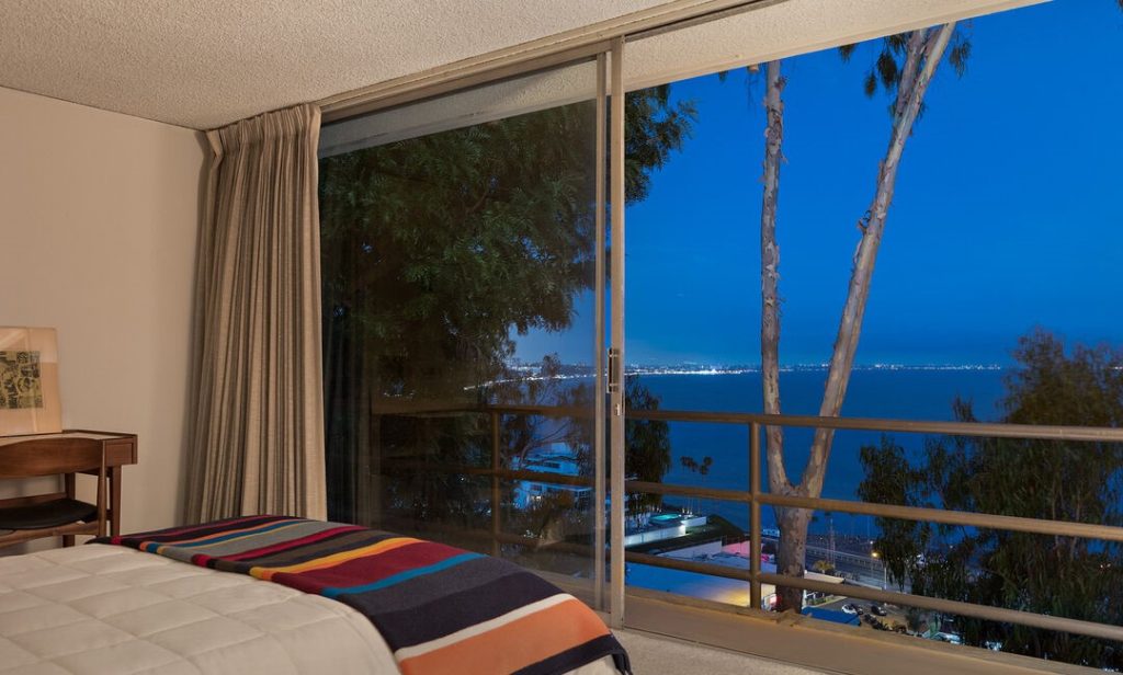 Spacious secondary room with wall of glass with magnificent ocean views.