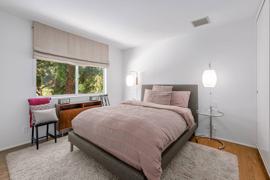 Spacious secondary bedroom with windows bringing in tons of natural light