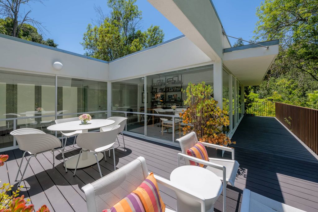 Deck overlooking Sparkling pool yard in this remarkable Hollywood Hills Dike Nagano Mid-Century Modern Home