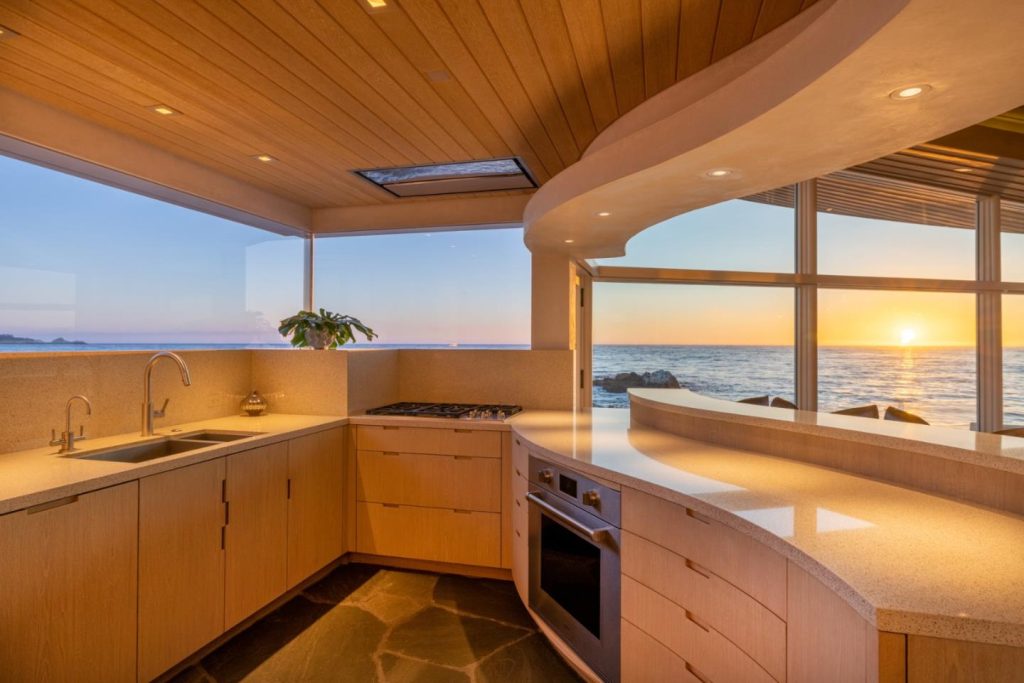 Dynamic chef's delight kitchen also sits right at the edge of the water, with panoramic ocean views.