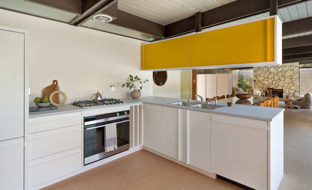 Brilliant kitchen in this Glendale Ray Kappe's Goetschel House retains plenty of its original charm after a recent refresh by HabHouse