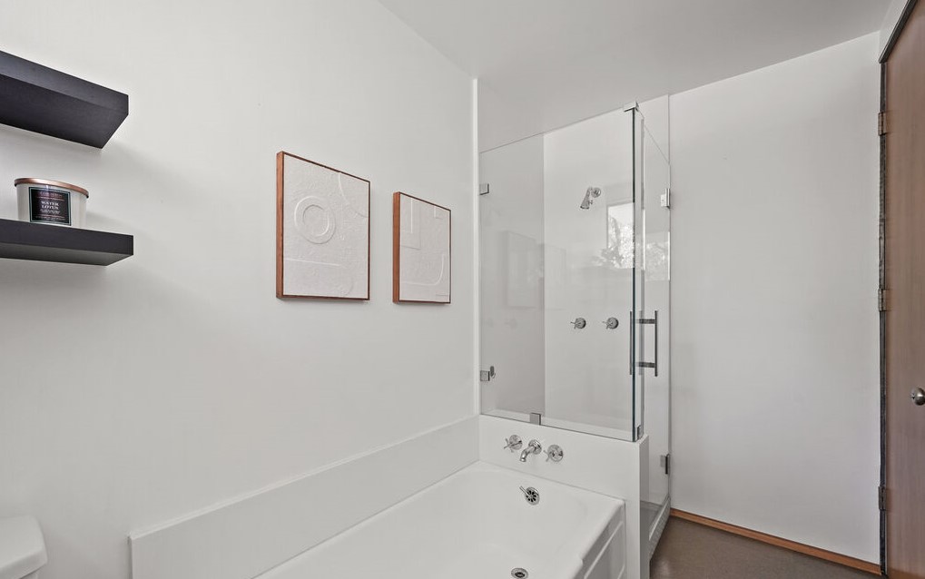 Clean lines and white walls in this architectural bathroom.