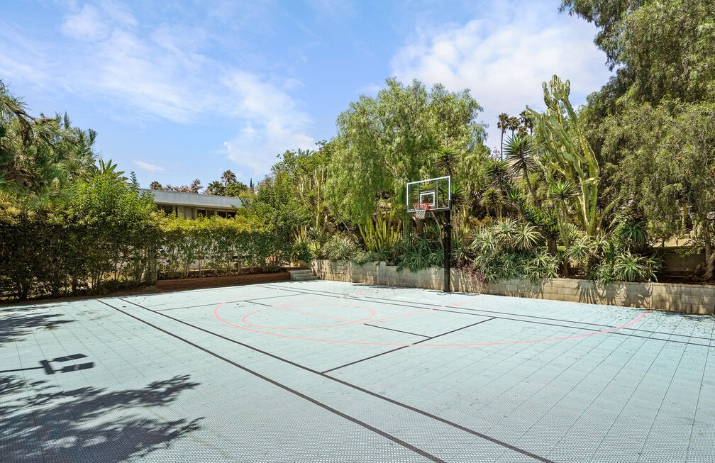 Further down the grounds sits a basketball court that could easily be converted into any recreational space of your choice.