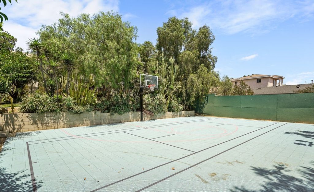 Further down the grounds sits a basketball court that could easily be converted into any recreational space of your choice.
