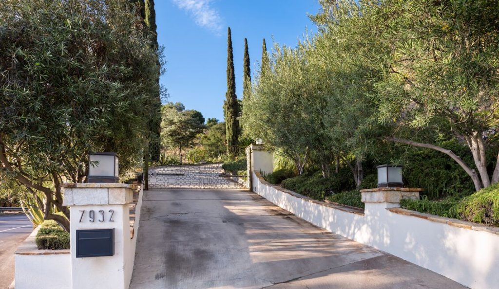 Situated behind a gate up a private drive, this architectural property may be a little too on the nose for a Hollywood cliche