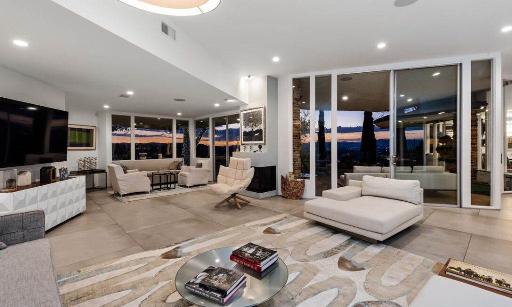 featuring an open floor plan, 10' ceilings, walls of glass throughout, and sunsets that will literally leave you speechless