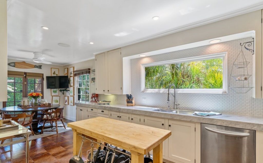 cook's kitchen with marble counters, large breakfast area and adjoining laundry room.