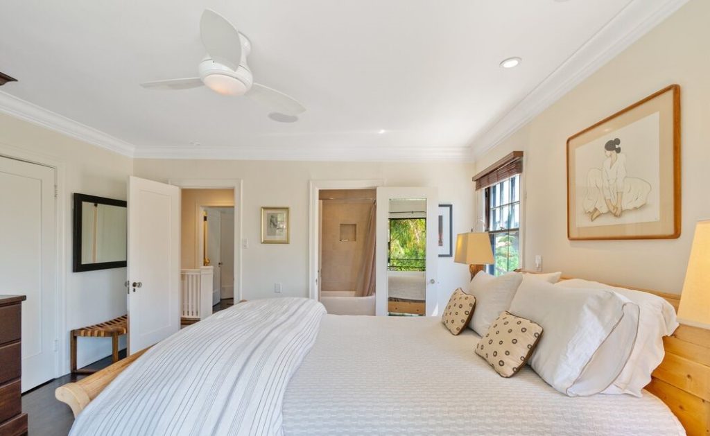 Upstairs are three large bedrooms and two bathrooms; the main bedroom has an updated bathroom