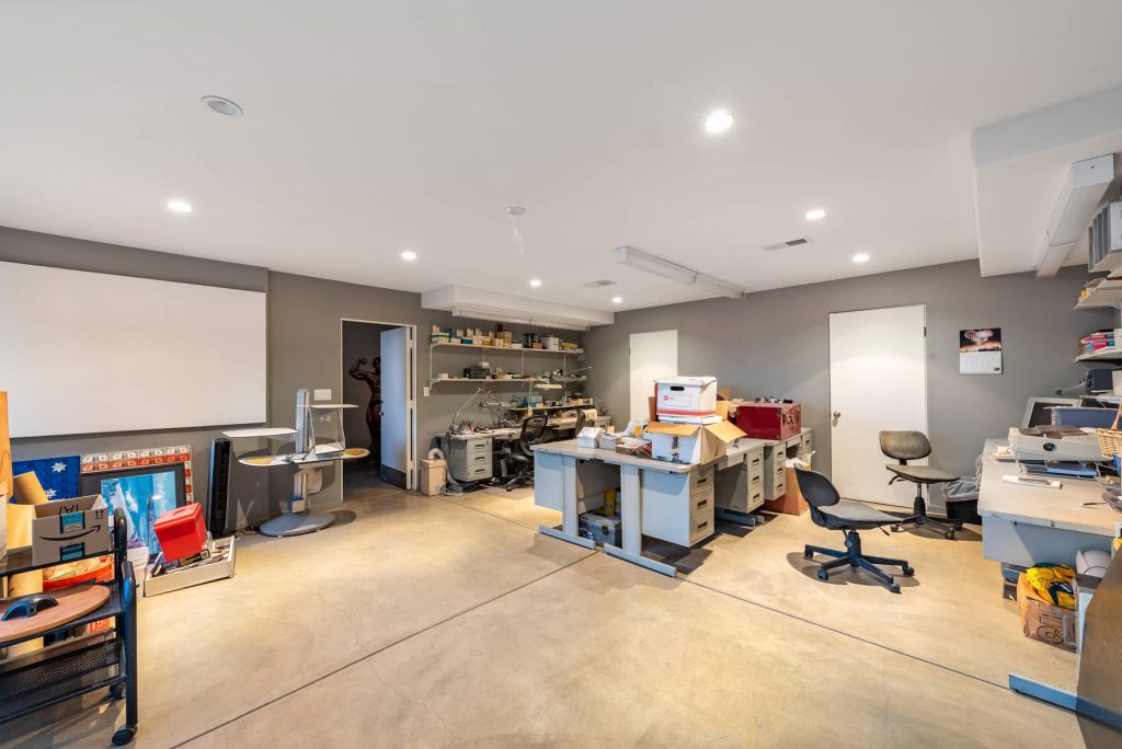 Downstairs is a generous sized room that can act as a great flex space for working or recreation.